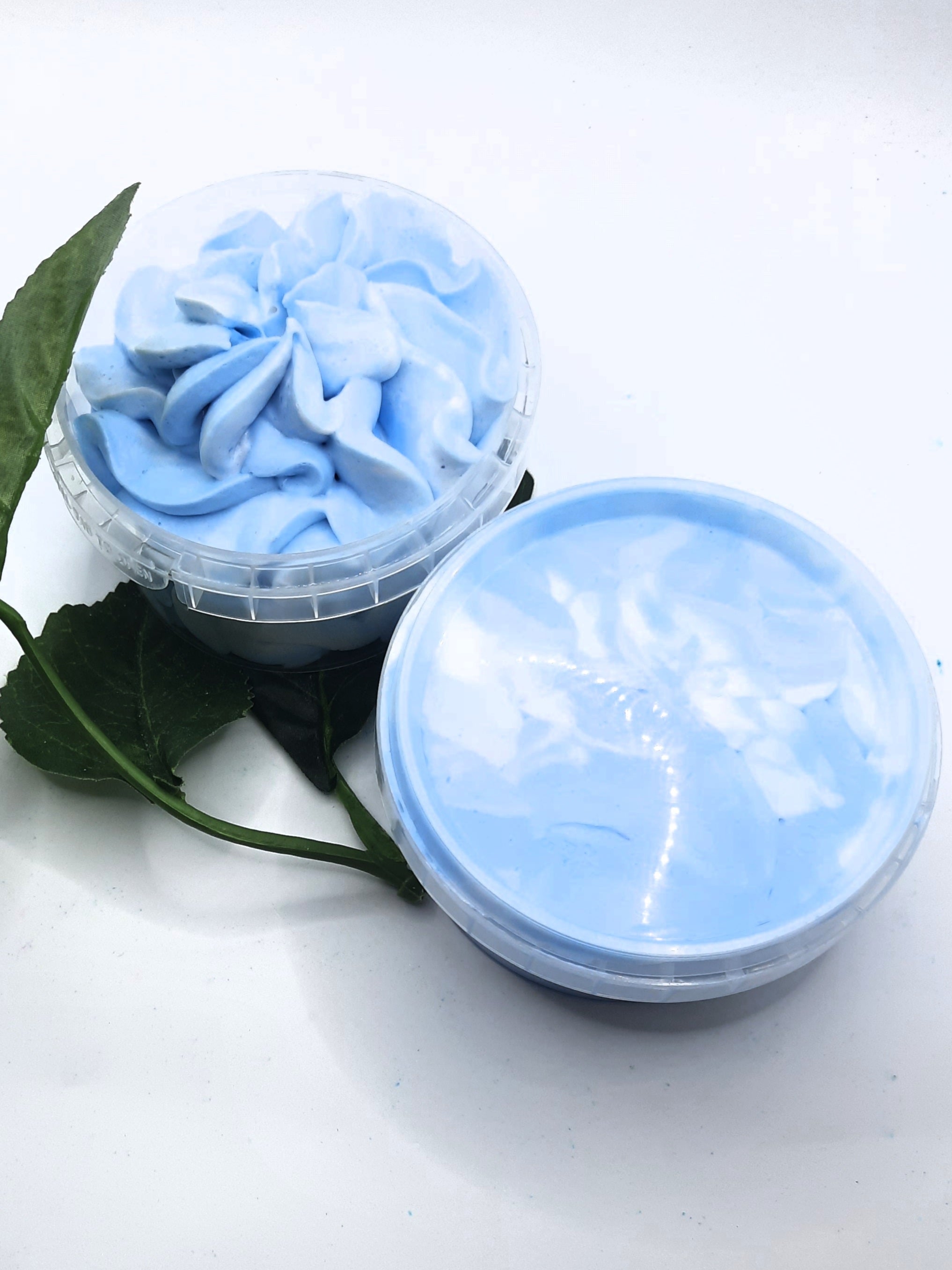 Image is of our Whipped soap piped in blue and white with Montego Bay scent. 